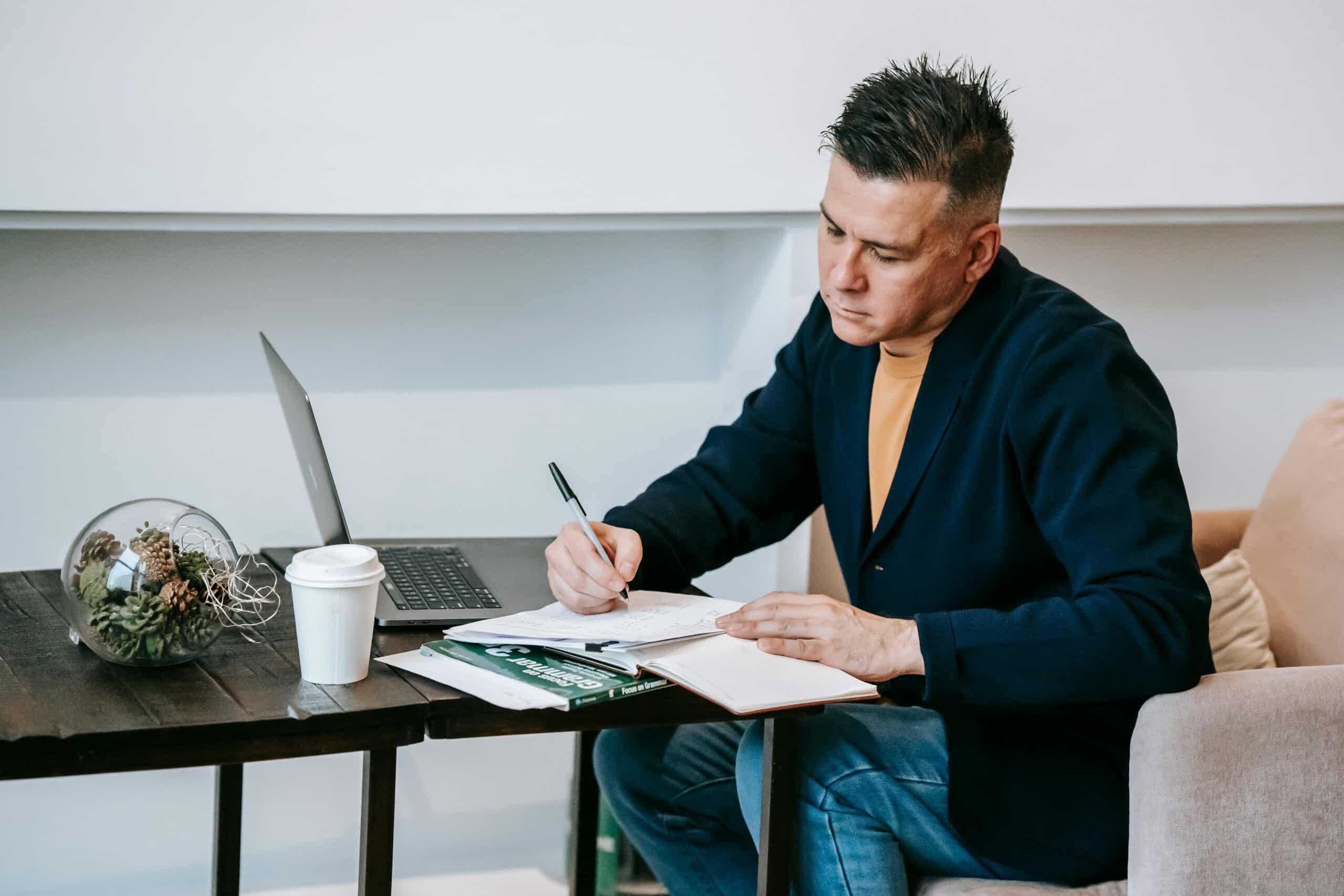 Salesperson sitting down and writing