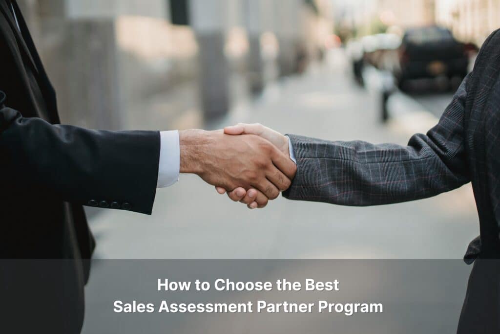 Two business professionals shaking hands forming a sales assessment partnership